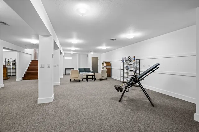 a view of a dinning room with furniture and floor to ceiling window