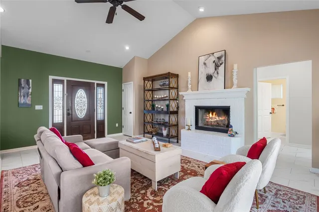 a view of a dining room with furniture wooden floor and a chandelier