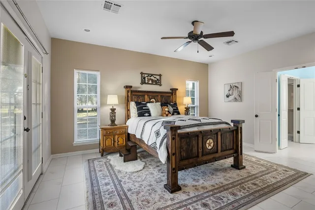a bathroom with a bathtub a sink and mirror