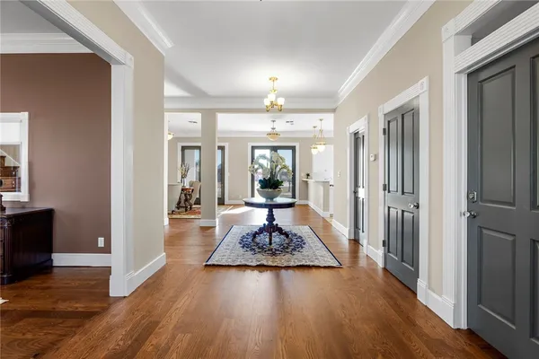 a living room with wooden floor and furniture