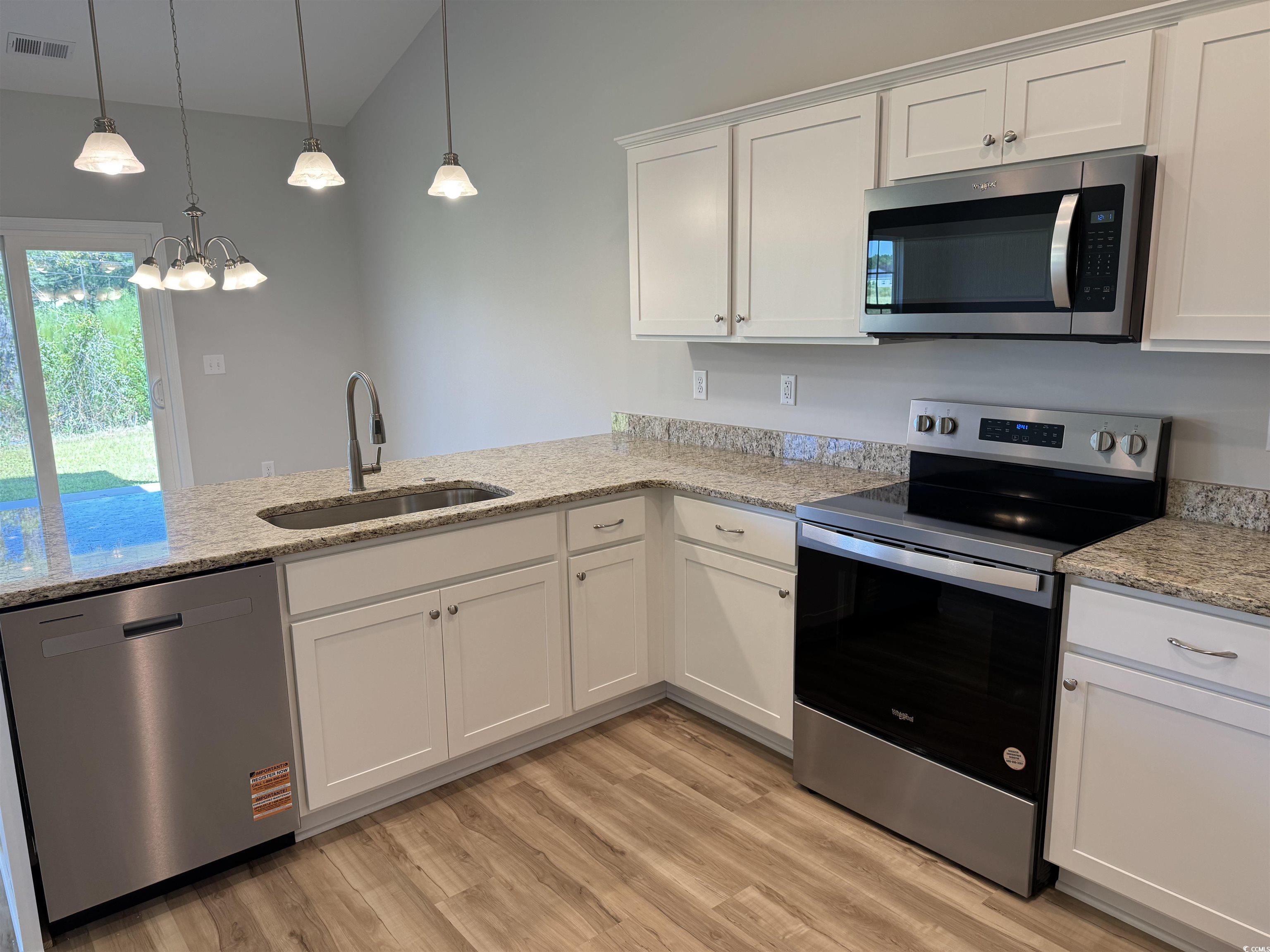 596 Shallow Cv Drive Conway, SC 29527 - Photo 13 of 25 Kitchen with stainless steel appliances, white cab