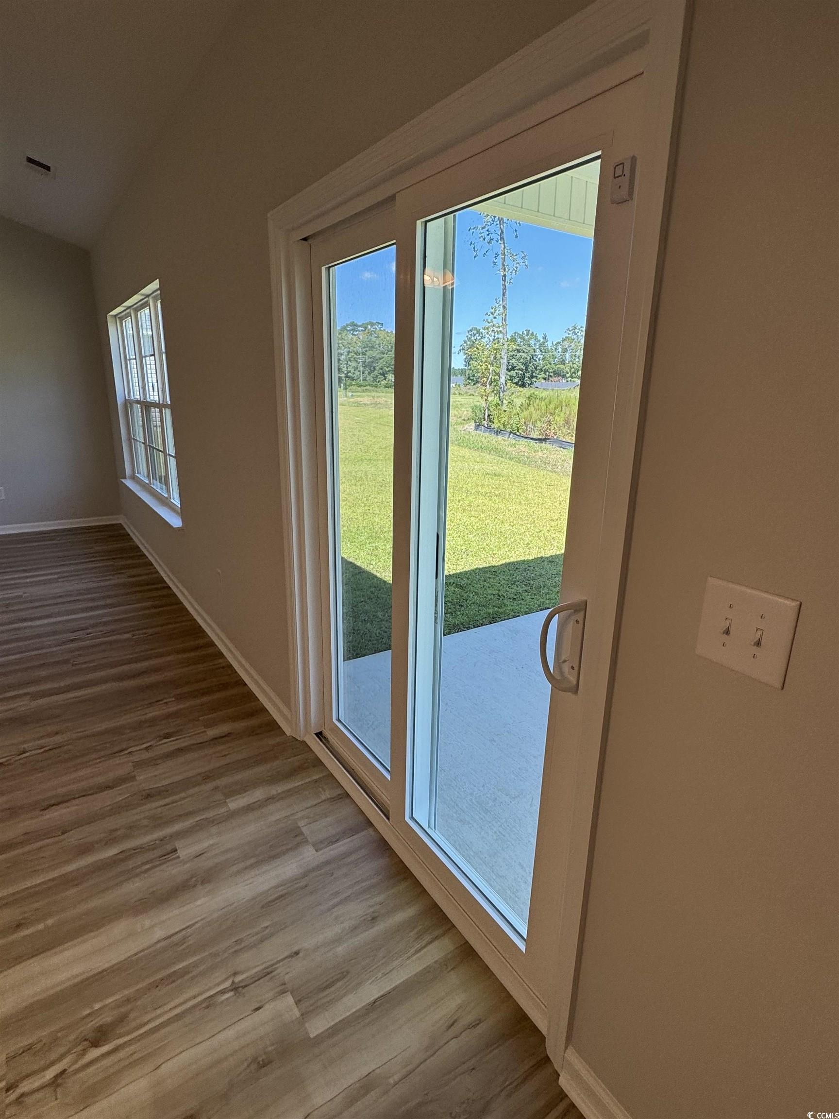 596 Shallow Cv Drive Conway, SC 29527 - Photo 16 of 25 Doorway featuring wood finished floors and vaulted