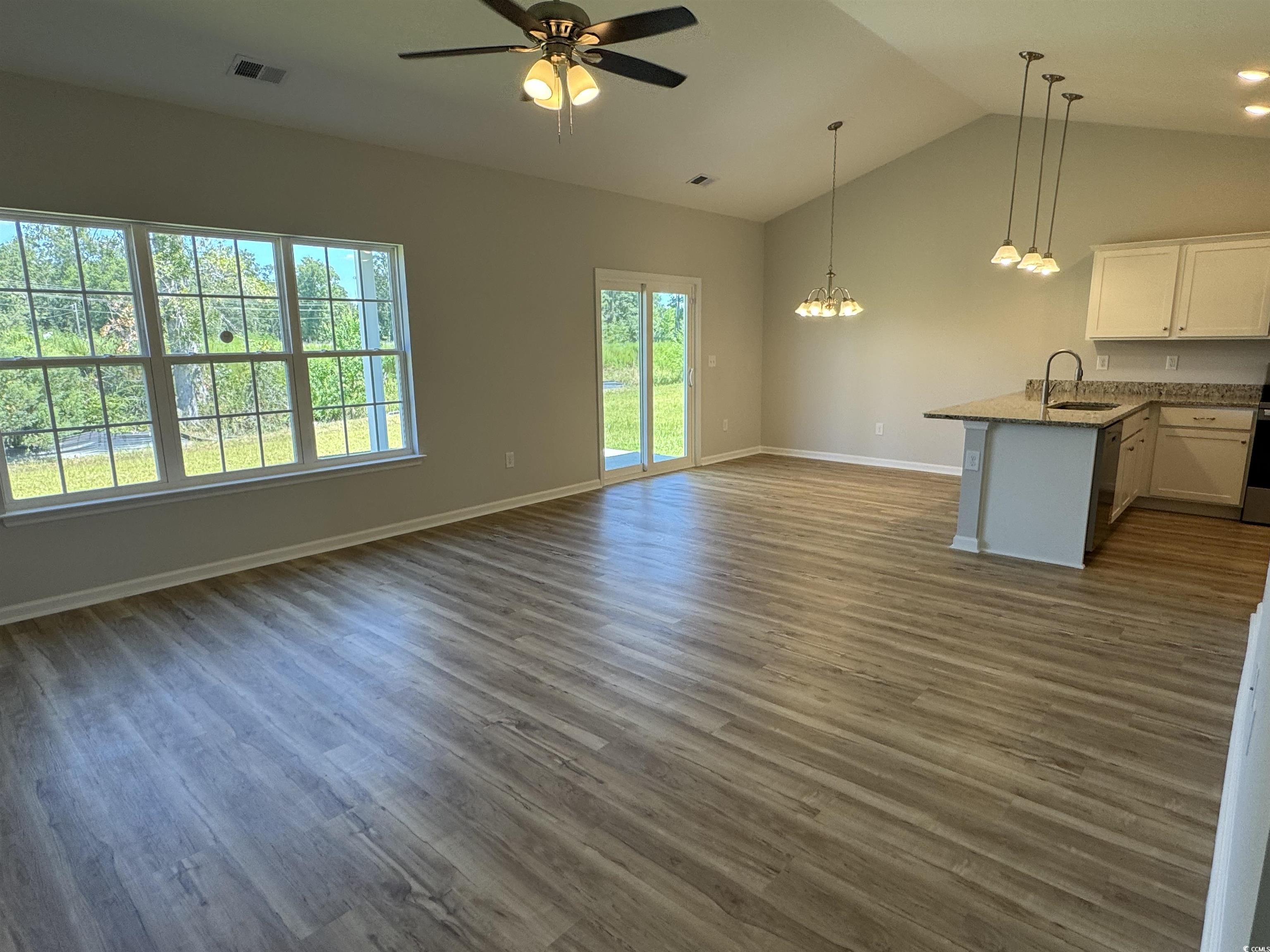 596 Shallow Cv Drive Conway, SC 29527 - Photo 18 of 25 Unfurnished living room featuring dark wood-style