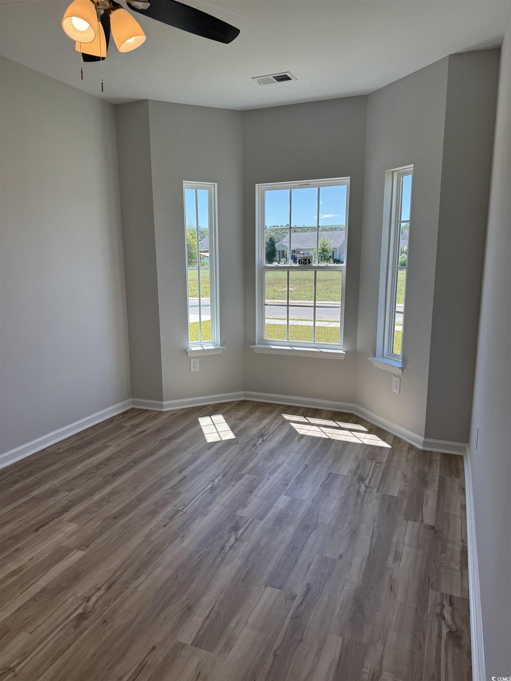596 Shallow Cv Drive Conway, SC 29527 - Photo 20 of 25 Spare room featuring wood finished floors and ceil
