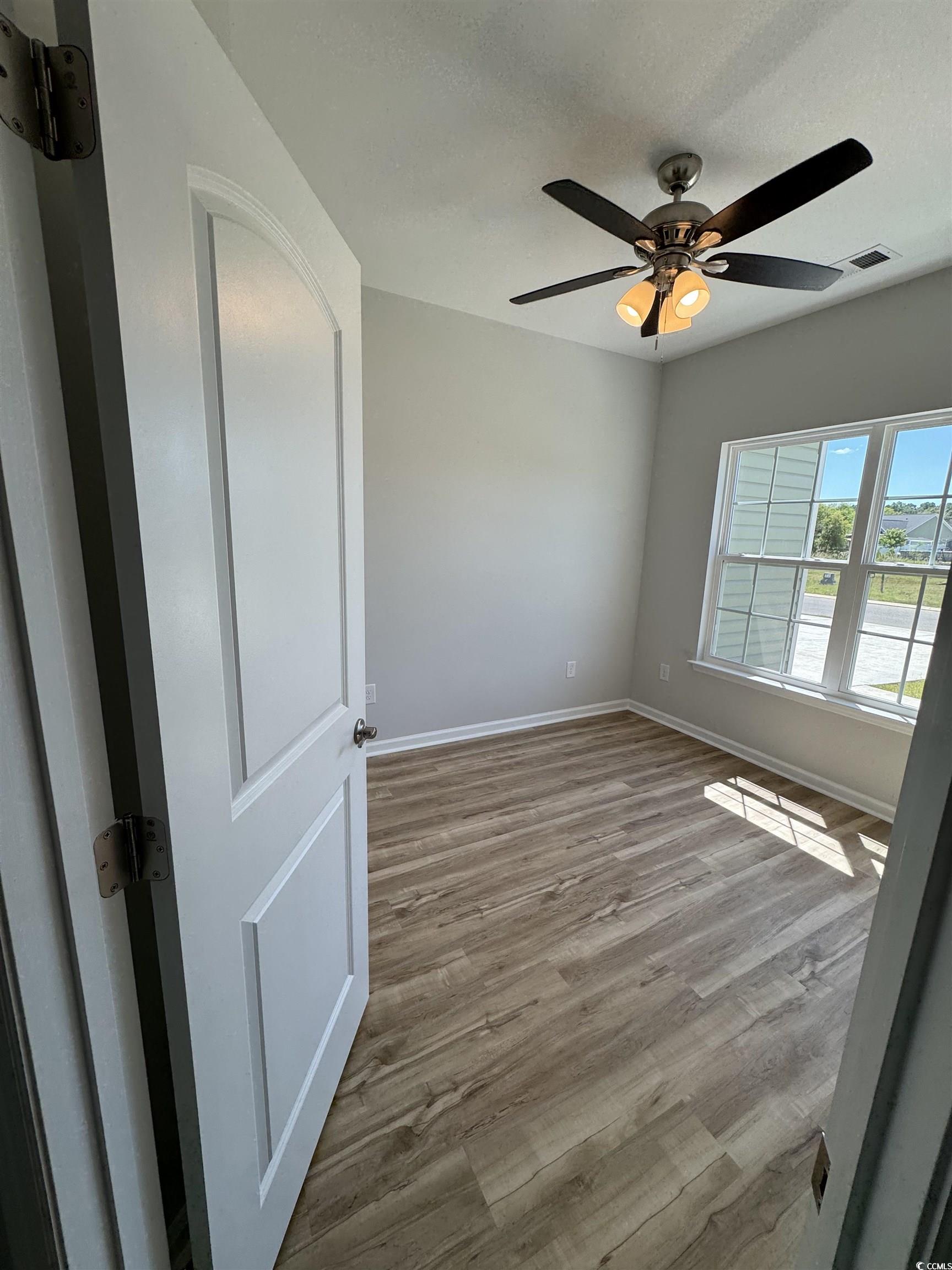 596 Shallow Cv Drive Conway, SC 29527 - Photo 23 of 25 Empty room featuring light wood-style flooring and