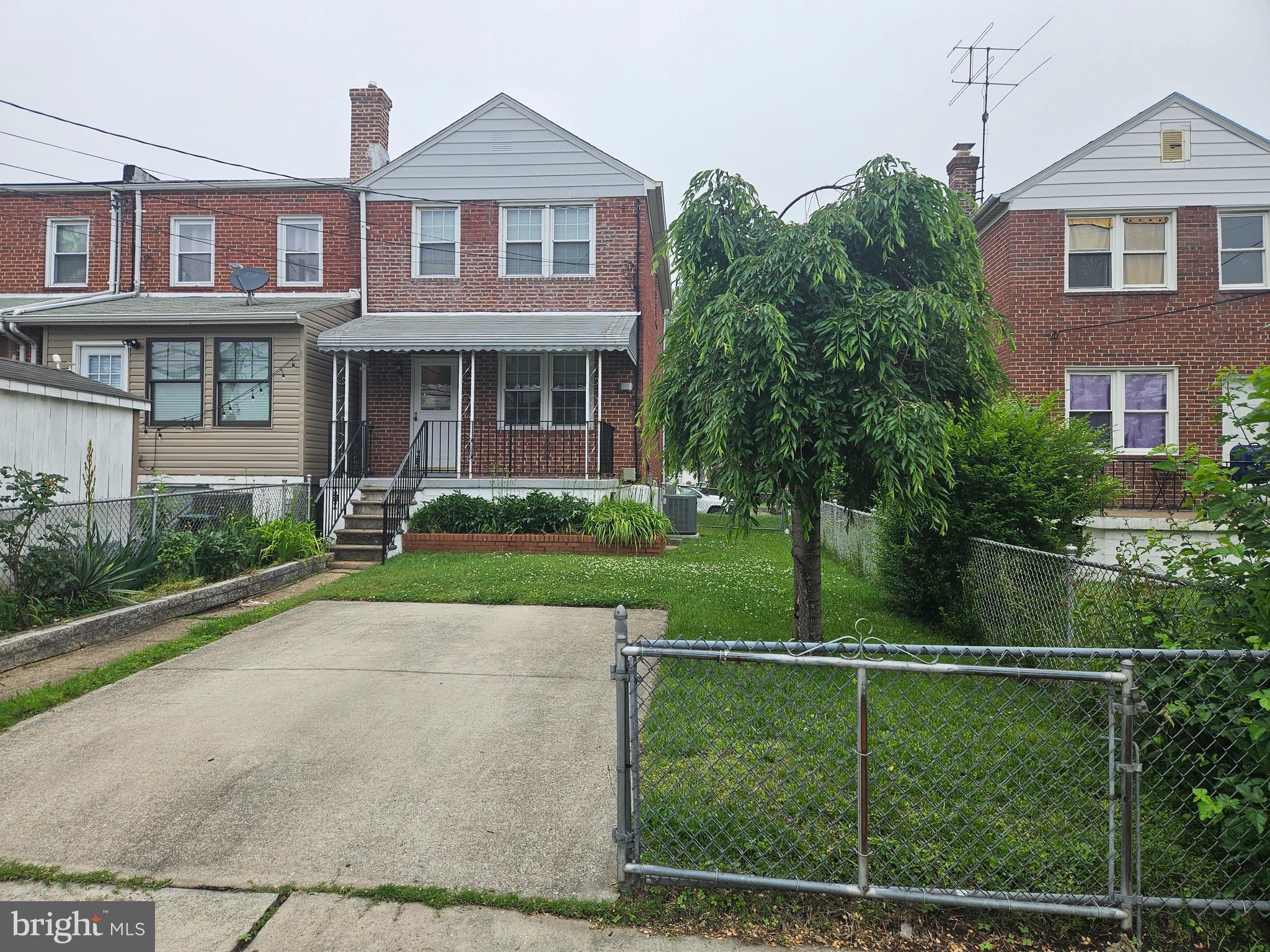 6907 Belclare Road Baltimore, MD 21222 - Photo 20 of 26 a front view of a house with garden