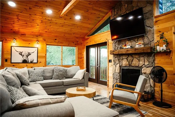 a outdoor living space with furniture and a fireplace