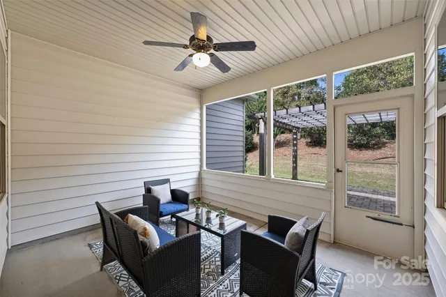 a view of a patio with a dining table and chairs