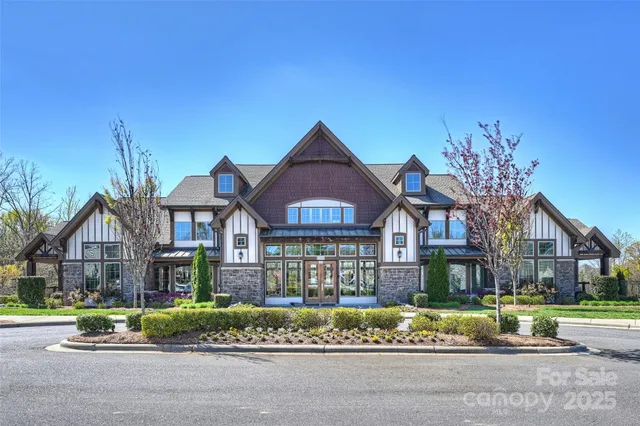 a living room with lots of furniture and wooden floors
