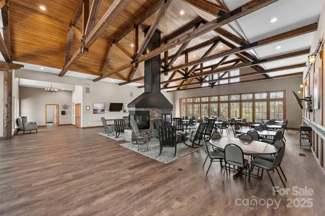 a view of a room with gym equipment and a large window