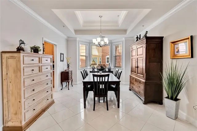 a view of a dining room with furniture and chandelier