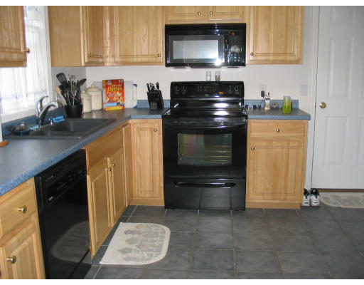 59 Ferris Street Springfield, MA 01151 - Photo 4 of 9 a kitchen with granite countertop a stove and a sink
