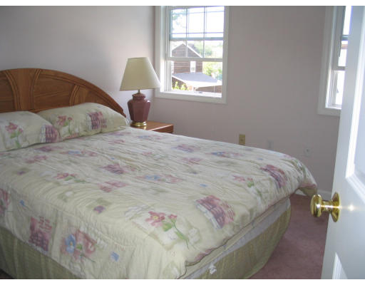 59 Ferris Street Springfield, MA 01151 - Photo 7 of 9 a bedroom with a bed and window