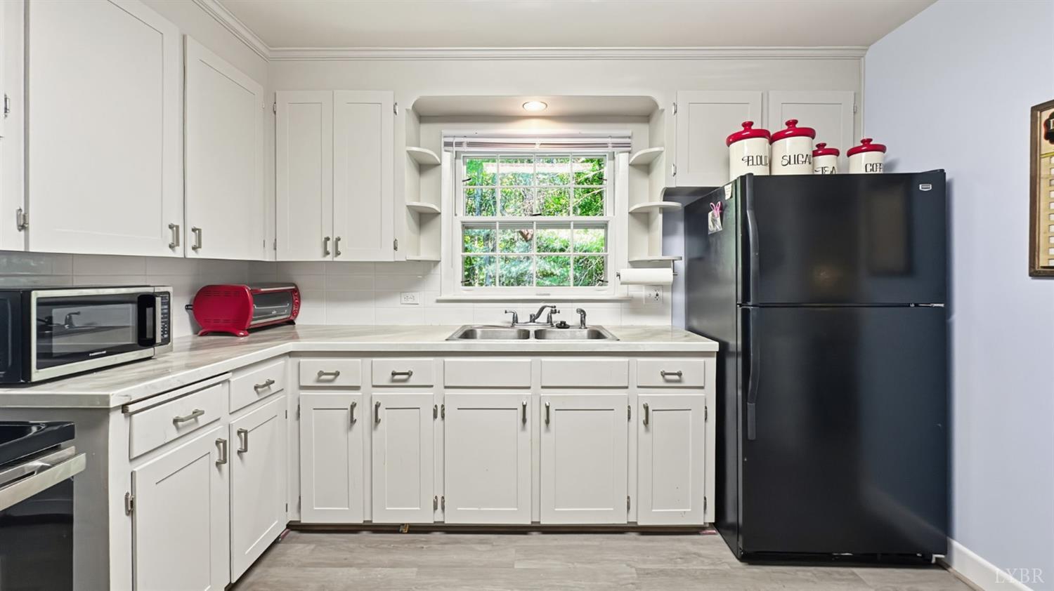 2044 Indian Hill Road Lynchburg, VA 24503 - Photo 3 of 30 a kitchen with granite countertop white cabinets and window