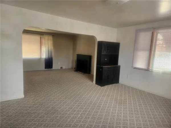 a big room with closet and windows