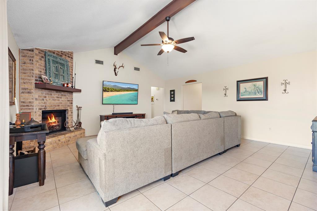 930 Vail Highlands Circle Hewitt, TX 76643 - Photo 14 of 33 a living room with furniture and a fireplace