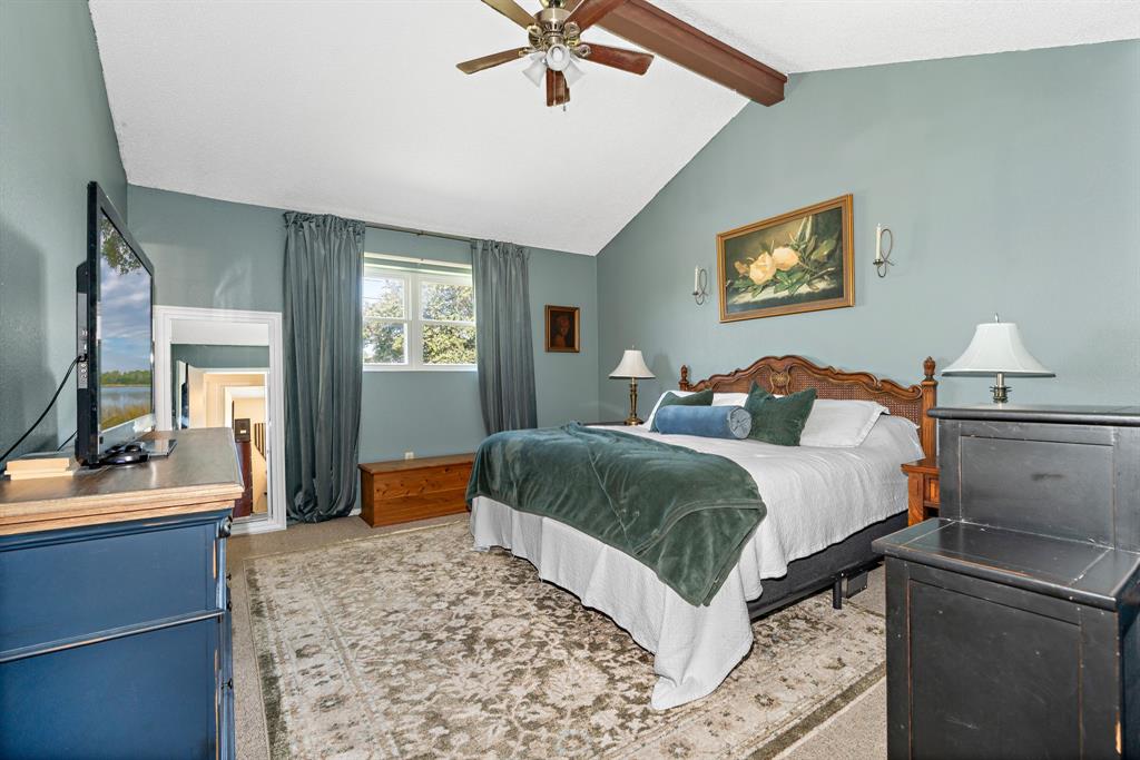 930 Vail Highlands Circle Hewitt, TX 76643 - Photo 16 of 33 a bedroom with a bed and a dresser