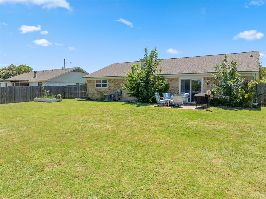 930 Vail Highlands Circle Hewitt, TX 76643 - Photo 29 of 33 a view of a house with a yard and potted plants