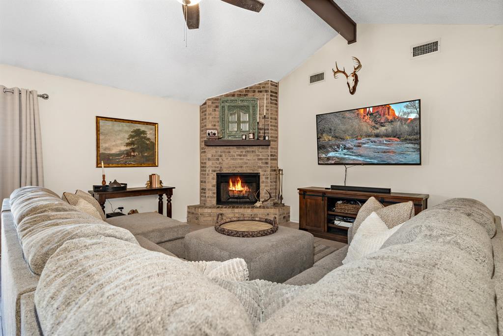 930 Vail Highlands Circle Hewitt, TX 76643 - Photo 7 of 33 a living room with furniture and a fireplace