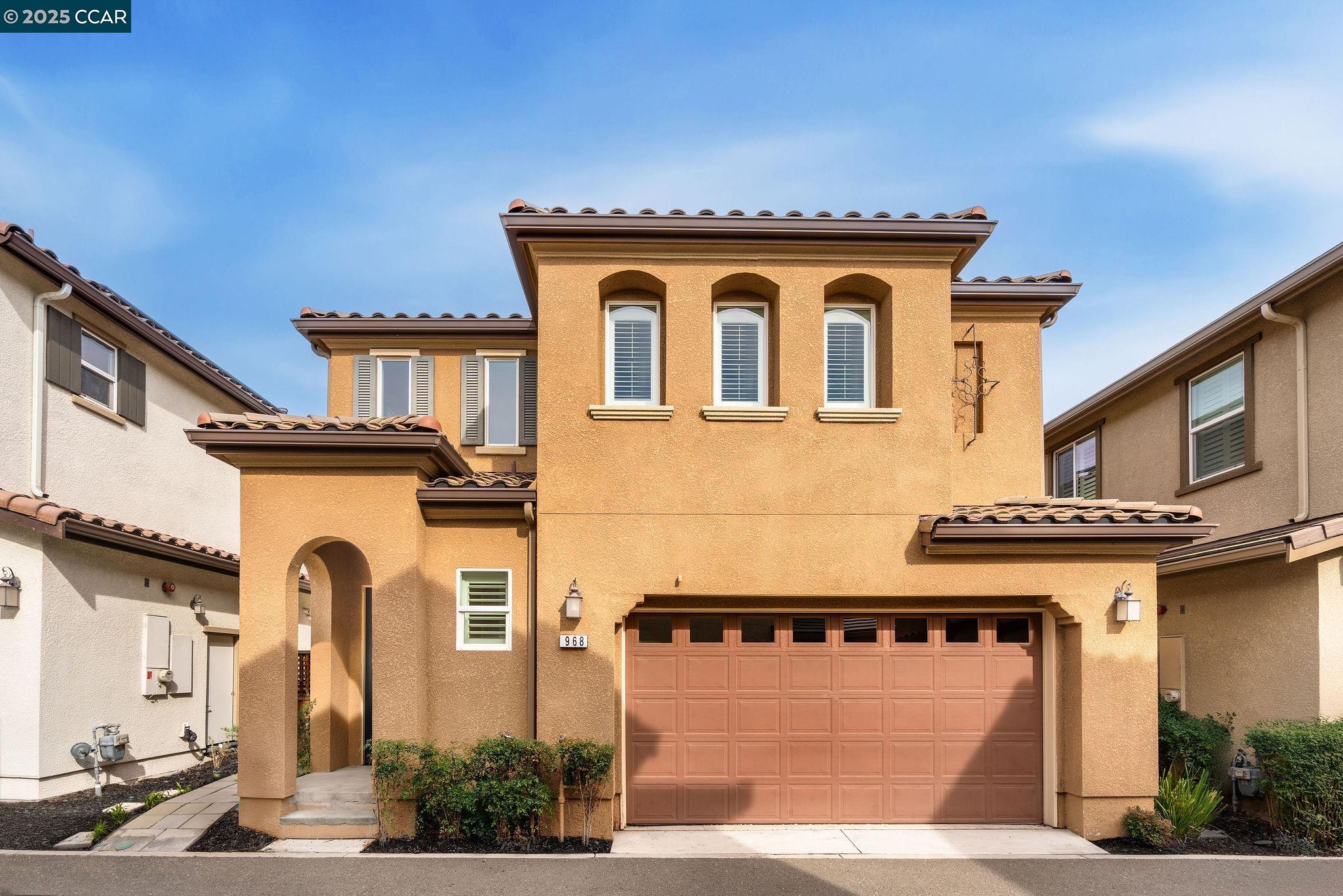 a front view of a house with a garage