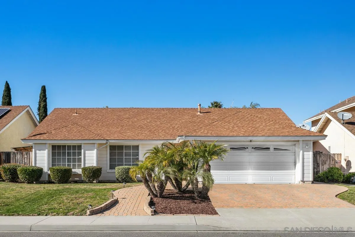 339 Holiday Way Oceanside, CA 92057 - Photo 1 of 20 a front view of a house with a yard