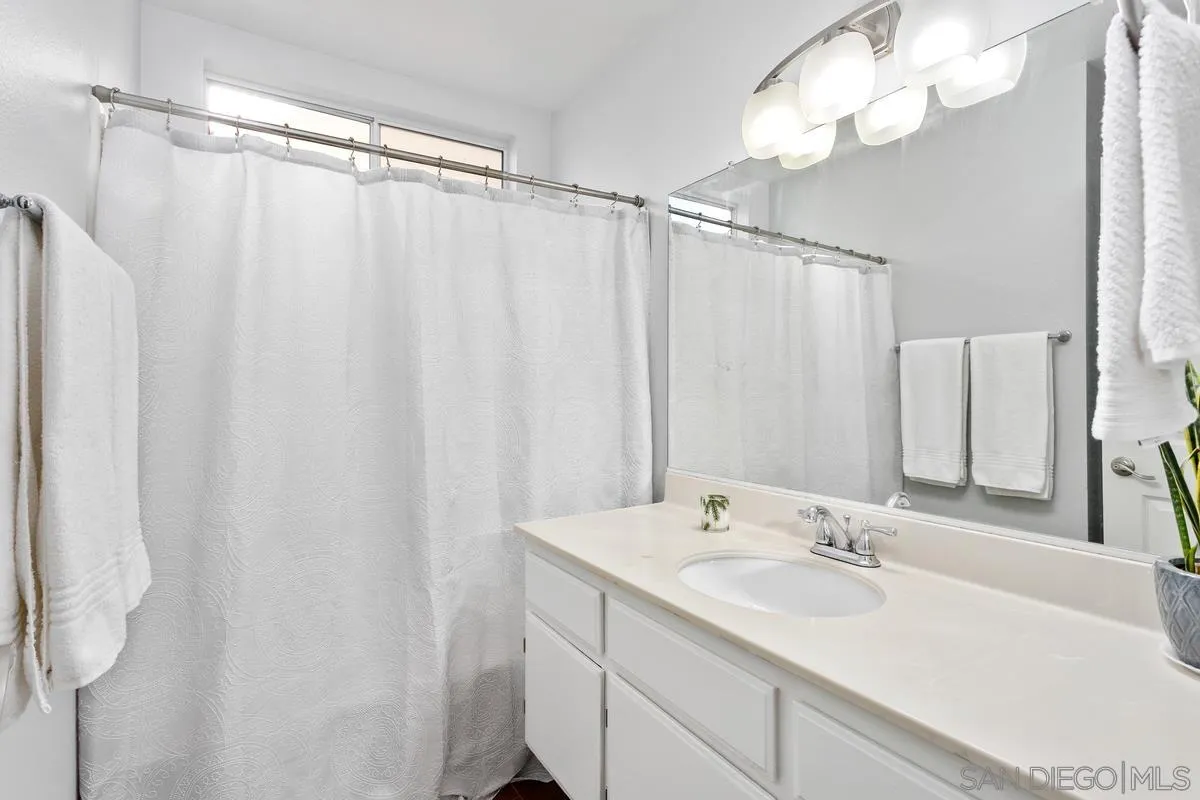339 Holiday Way Oceanside, CA 92057 - Photo 17 of 20 a bathroom with a sink double vanity and a mirror