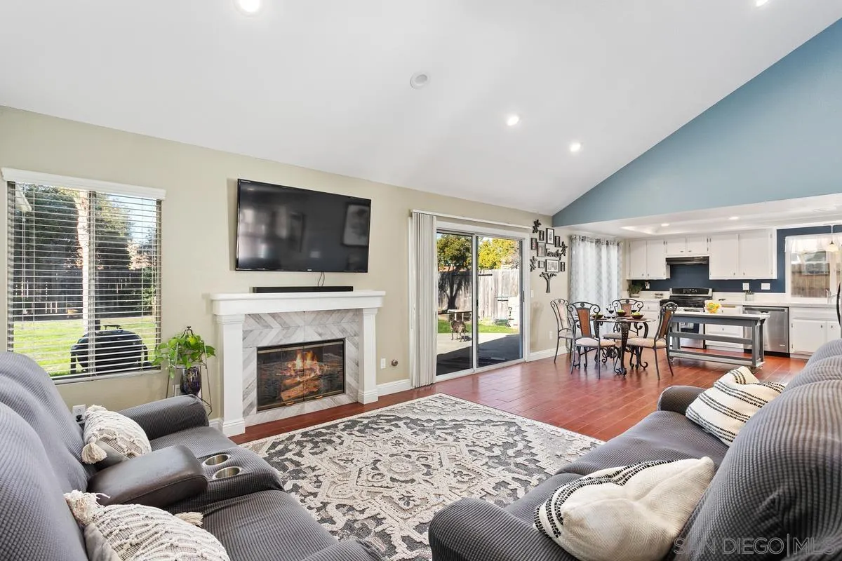339 Holiday Way Oceanside, CA 92057 - Photo 3 of 20 a living room with furniture fireplace and window