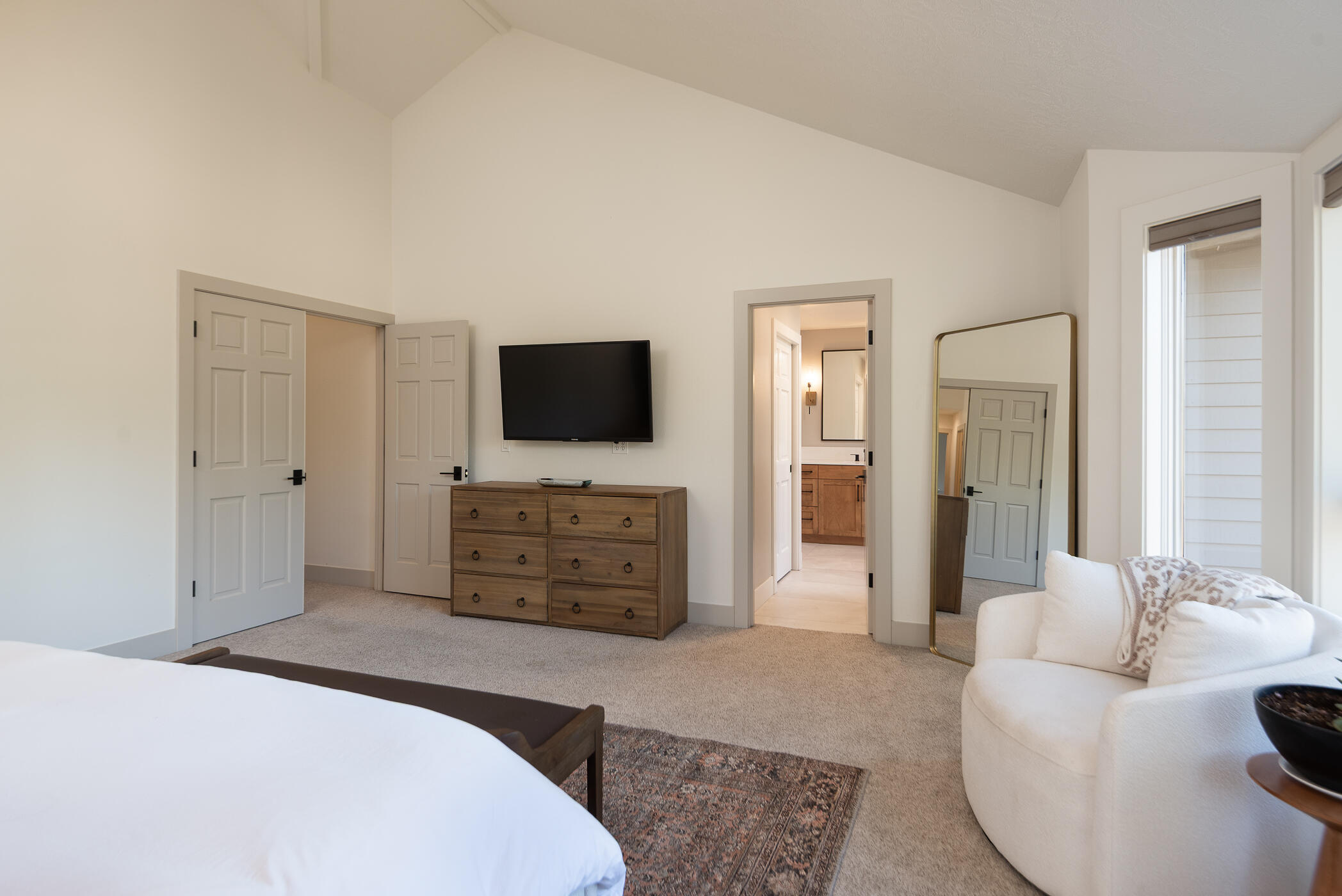 60012 West Ridgeview Drive Bend, OR 97702 - Photo 14 of 55 a bedroom with furniture and a flat screen tv