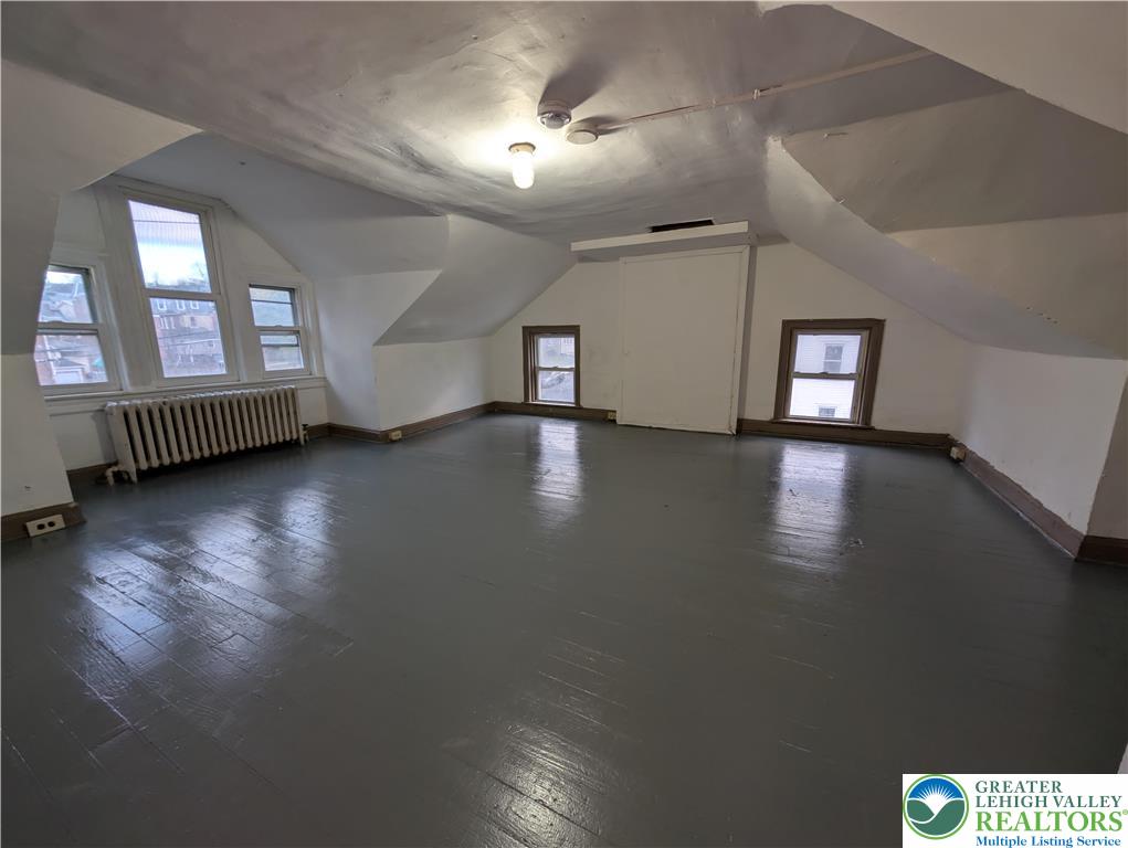 426 Carlton Avenue, Unit 2 Bethlehem, PA 18015 - Photo 16 of 18 a view of a livingroom with hardwood floor and a ceiling fan