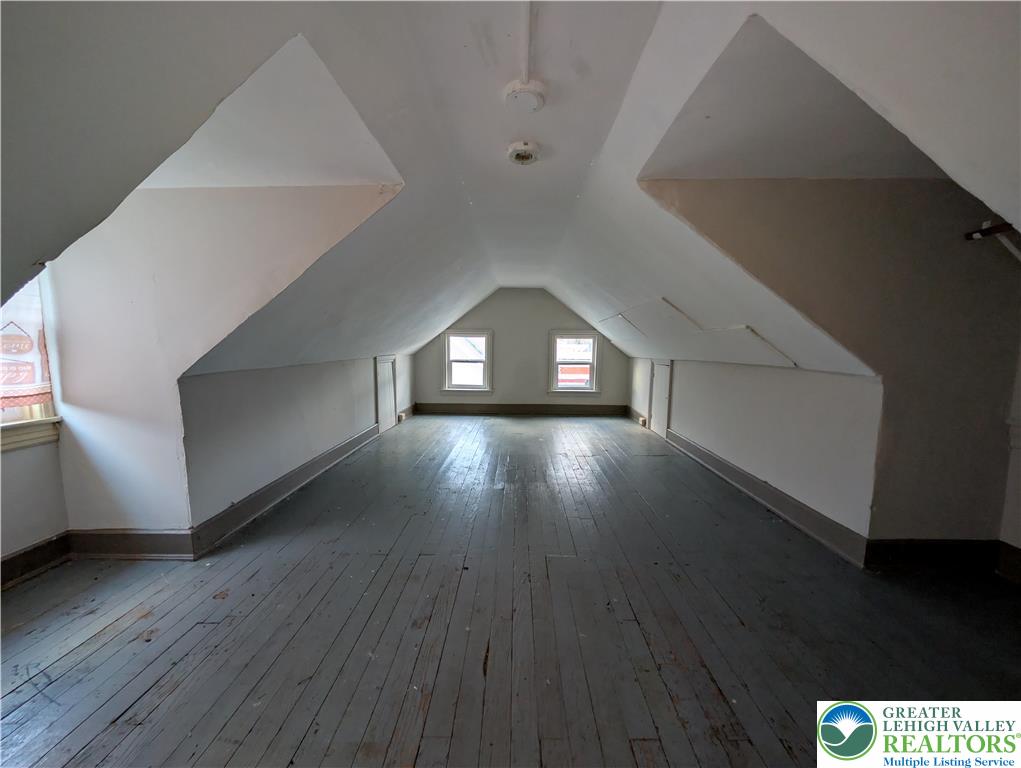 426 Carlton Avenue, Unit 2 Bethlehem, PA 18015 - Photo 18 of 18 a view of an empty room with wooden floor and a window