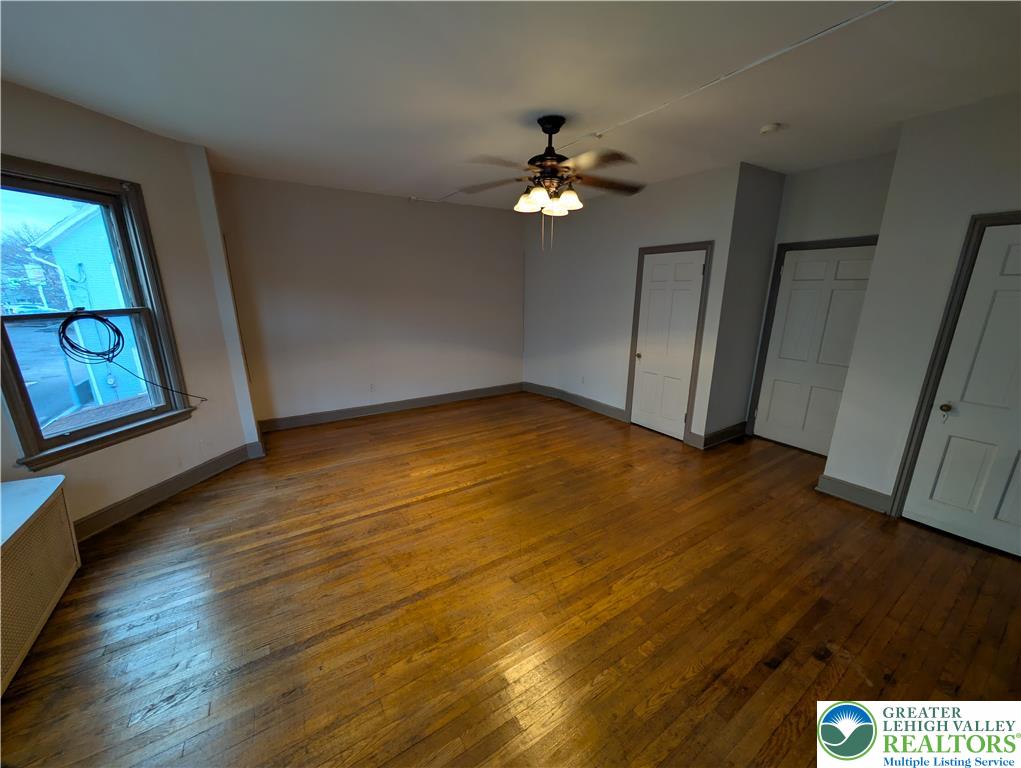 426 Carlton Avenue, Unit 2 Bethlehem, PA 18015 - Photo 7 of 18 a view of empty room with wooden floor and fan