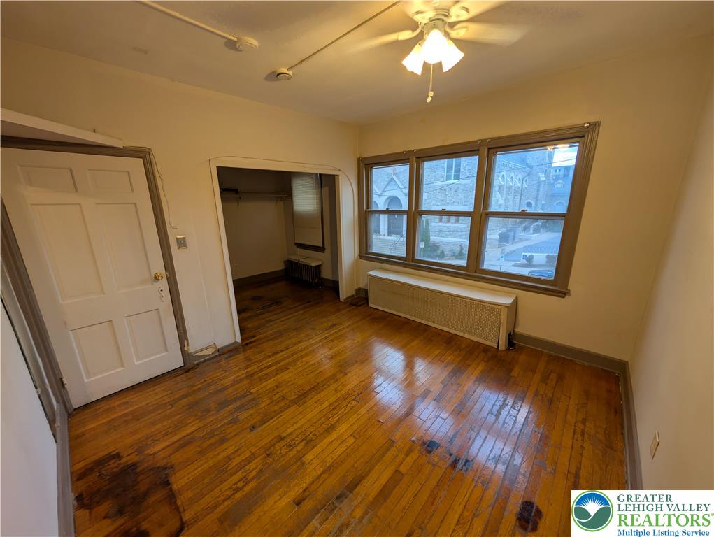 426 Carlton Avenue, Unit 2 Bethlehem, PA 18015 - Photo 10 of 18 wooden floor in an empty room with a window
