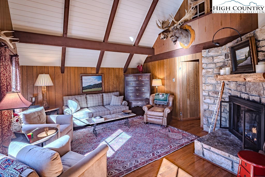 335 Cherry Drive Boone, NC 28607 - Photo 8 of 32 a living room with furniture and a fireplace