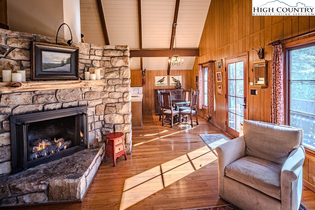 335 Cherry Drive Boone, NC 28607 - Photo 9 of 32 a living room with furniture large window and a fireplace