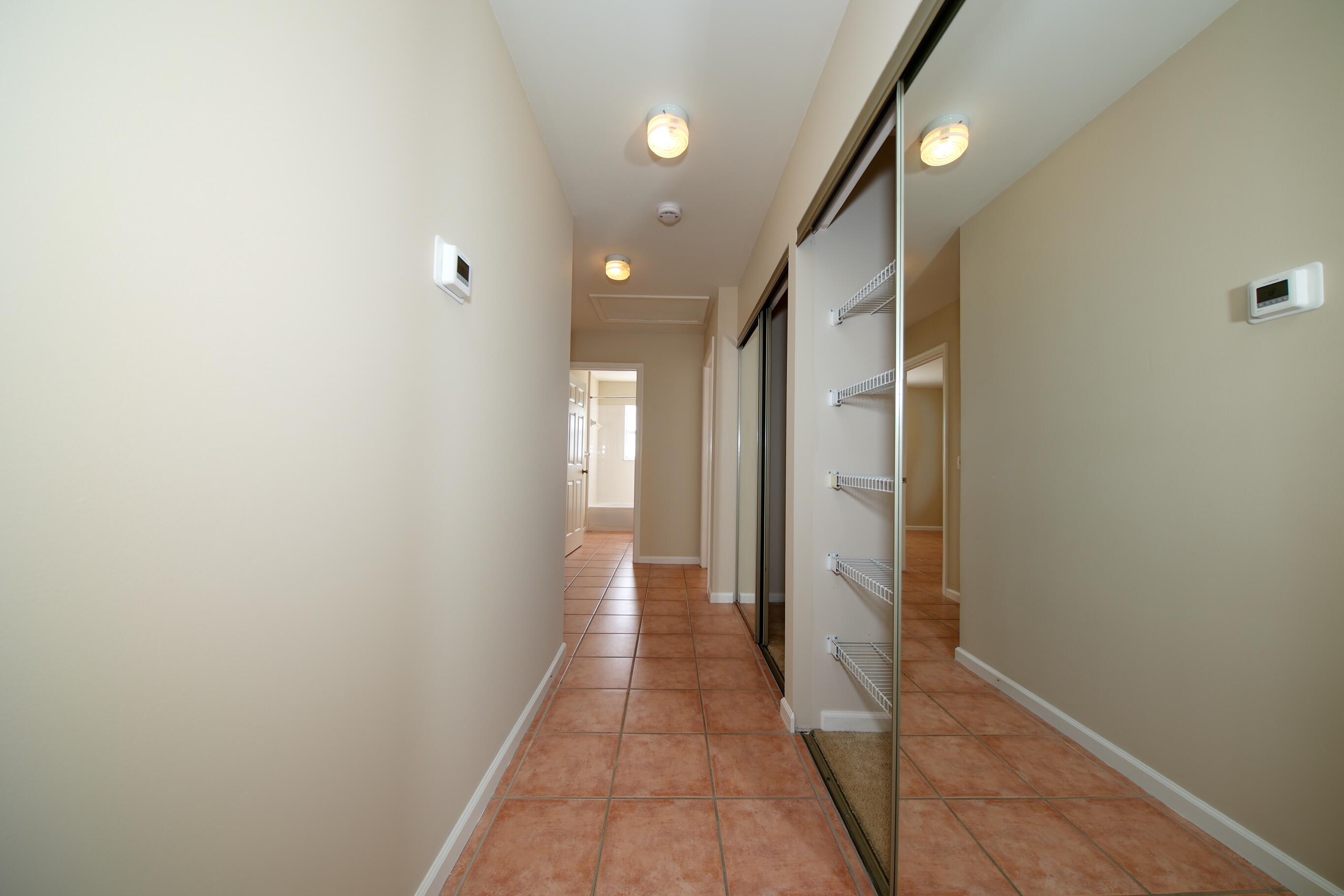 141 East Riverside Drive, Unit 40 Jupiter, FL 33469 - Photo 8 of 27 Main Hallway Storage Closets