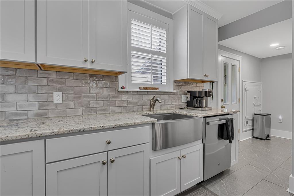 340 4th Street Beaver, PA 15009 - Photo 12 of 42 a kitchen with stainless steel appliances granite countertop a sink stove and cabinets