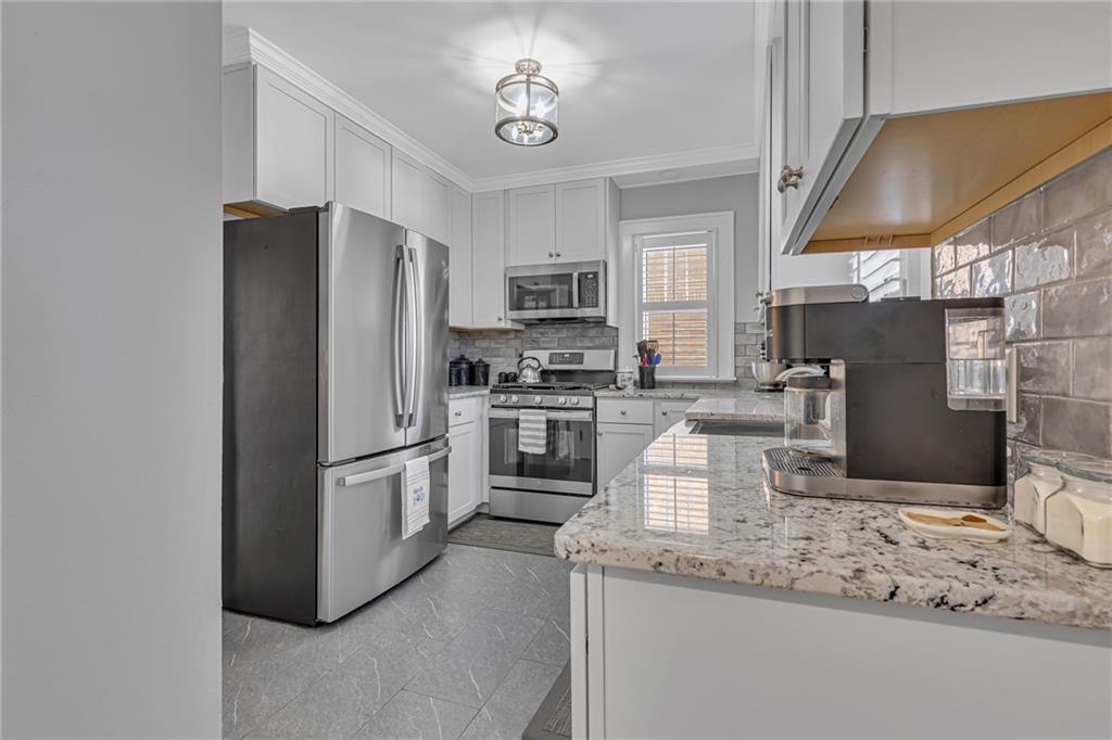 340 4th Street Beaver, PA 15009 - Photo 13 of 42 a kitchen with refrigerator cabinets and a counter top space