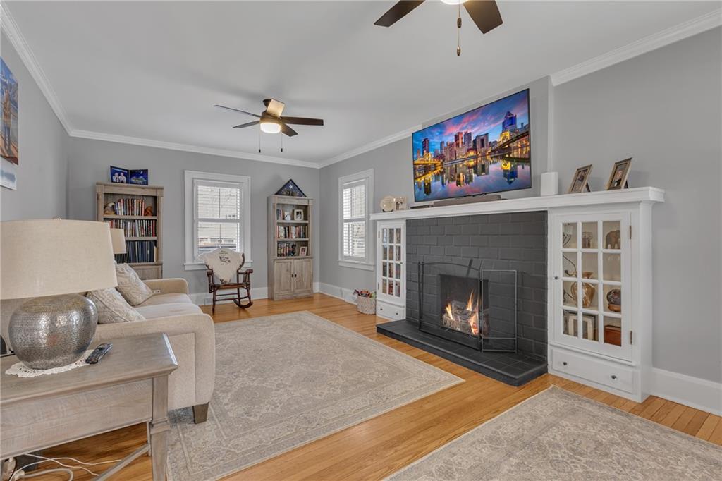 340 4th Street Beaver, PA 15009 - Photo 15 of 42 a living room with furniture a fireplace and a flat screen tv