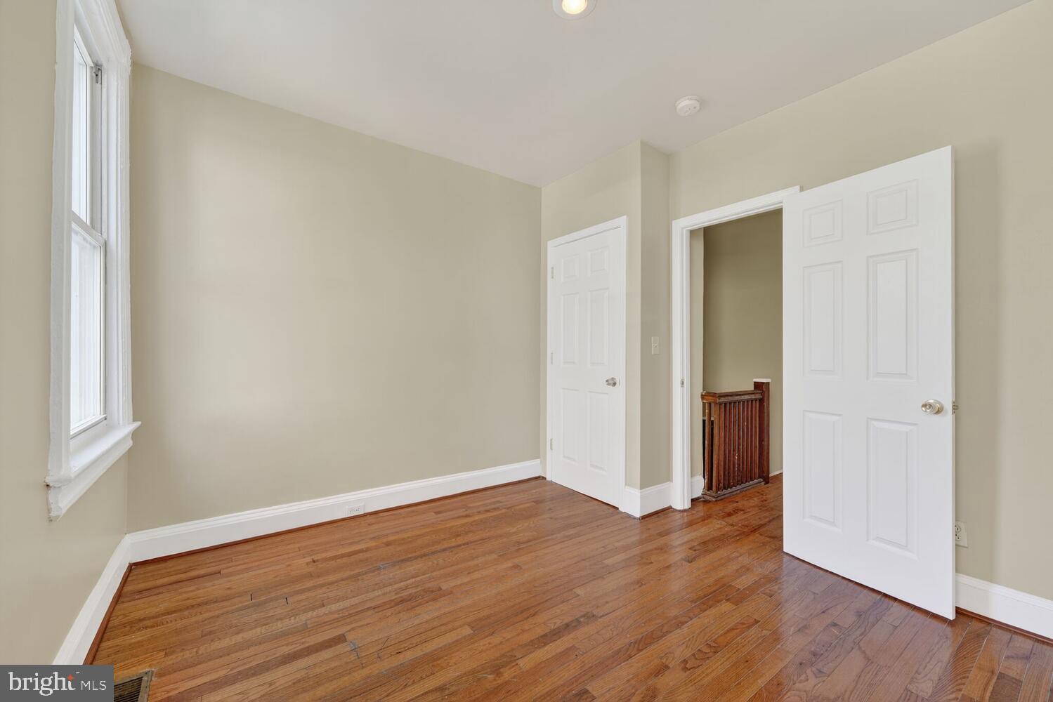 833 L Street Northeast Washington, DC 20002 - Photo 8 of 15 a view of an empty room with wooden floor