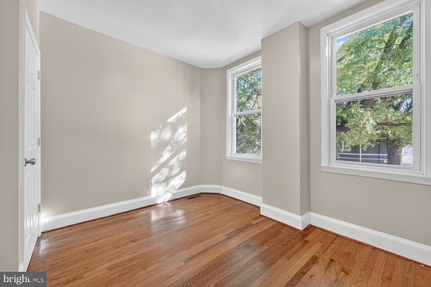 833 L Street Northeast Washington, DC 20002 - Photo 10 of 15 a view of empty room with wooden floor and fan