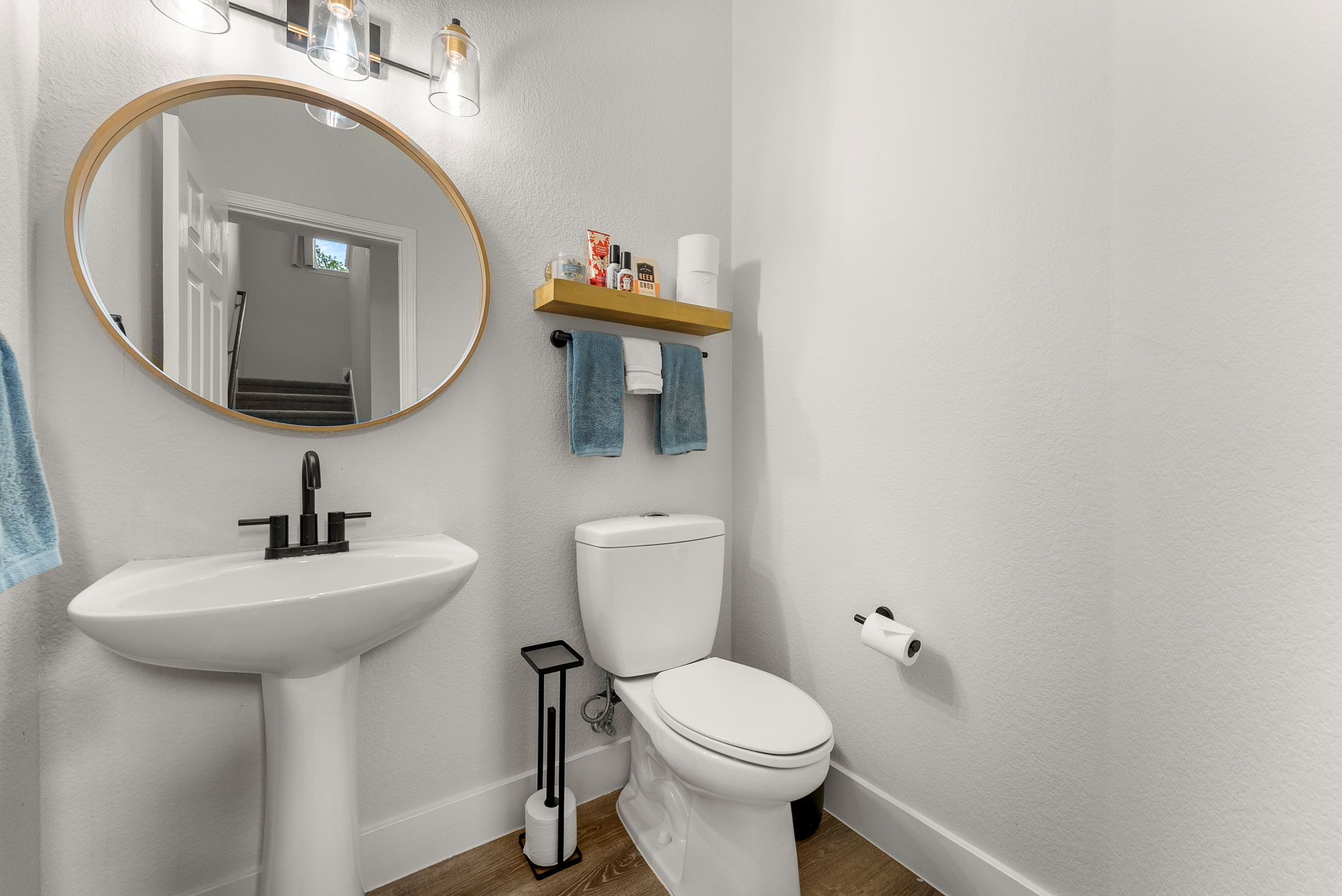 110 Stone Crest Boulevard Buda, TX 78610 - Photo 11 of 29 a bathroom with a toilet sink and mirror