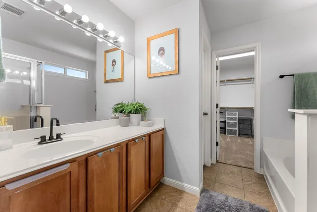 a bathroom with a tub and shower