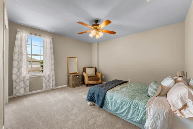 a living room with furniture and a piano