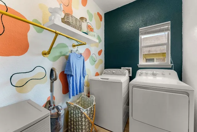 a view of a patio with table and chairs and potted plants