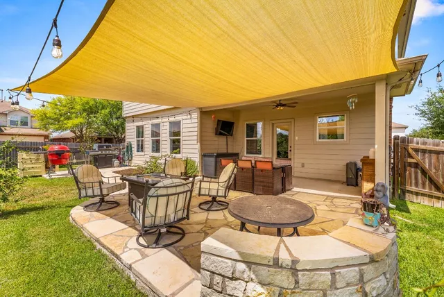 a view of a house with chair and tables
