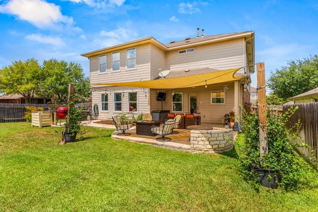 a house view with swimming pool in front of it