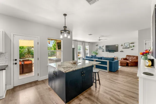 a workspace with furniture window and wooden floor