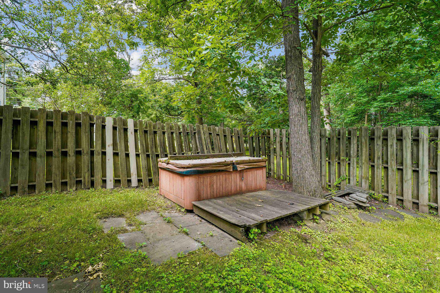 16 Maple Avenue Washington Grove, MD 20880 - Photo 9 of 58 Secluded backyard oasis with lush greenery.