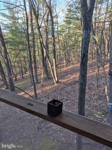 a view of a yard from a balcony