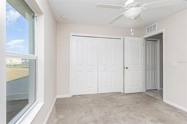 a bathroom with a granite countertop sink a toilet and bathtub